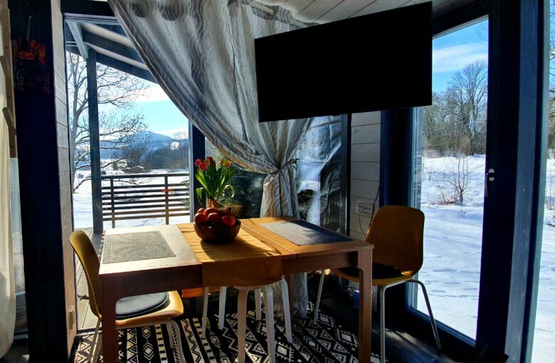 Cozy dining area with a view at Bohemian Homes, Bohemian Switzerland, Czech Republic.