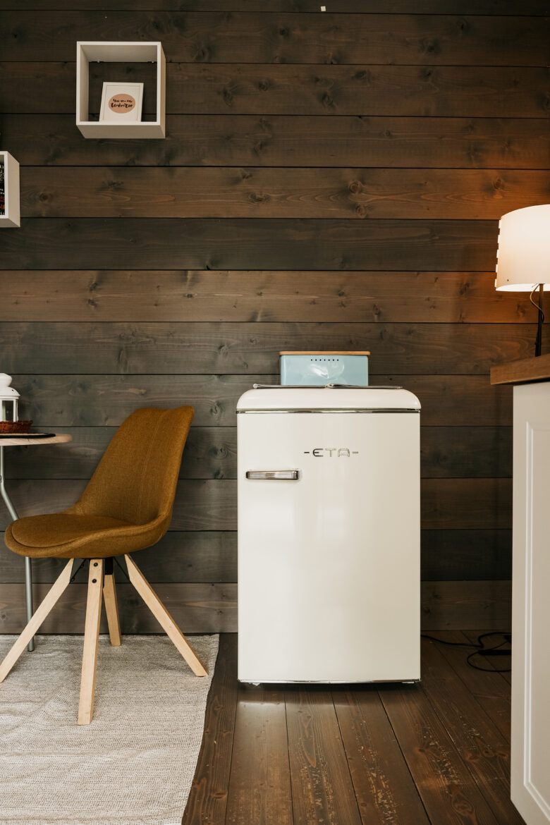 Cozy interior with a retro fridge at Bohemian Homes.