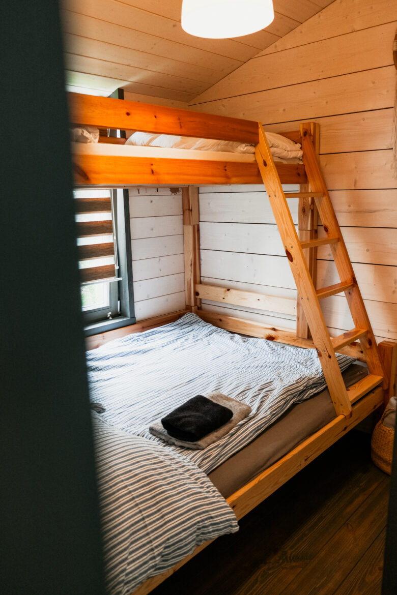 Cozy bunk bed in a cabin at Bohemian Homes, Bohemian Switzerland, Czech Republic.
