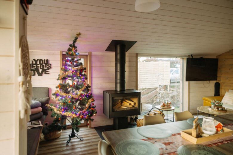 Cozy interior of Bohemian Homes with a Christmas tree.