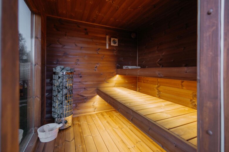 Sauna interior with wooden benches at Bohemian Homes.